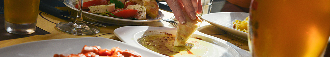 Eating Greek Mediterranean at Churrasco Grill restaurant in Fresno, CA.